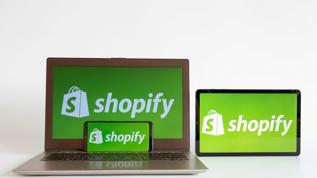 Shopify website development services displayed on laptop, tablet, and mobile devices